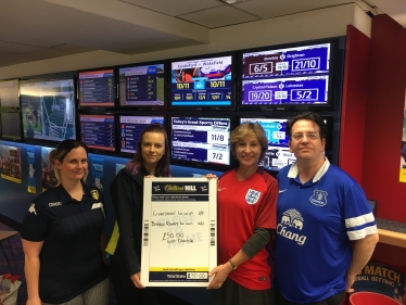 Rebecca Pow with staff at William Hill